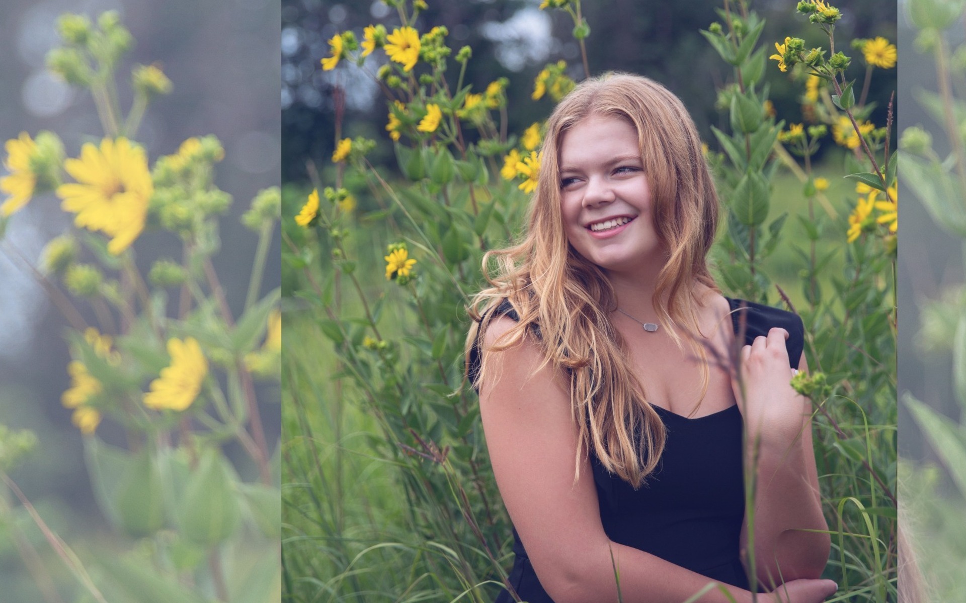 hs senior girl laughs off camera in a field of yellow flowers