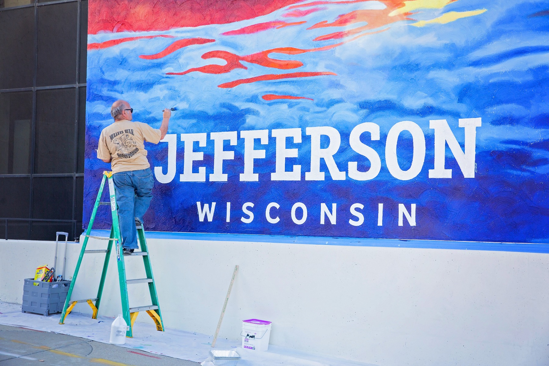 artist completes work on a mural for Jefferson Wisconsin
